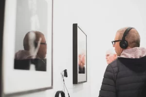 man-staring-framed-wall-art