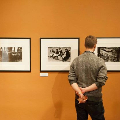 men looking on paintings