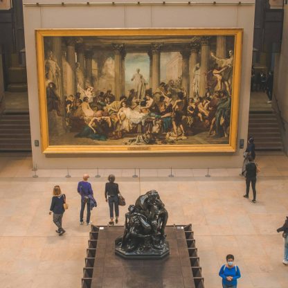 people looking at last supper painting