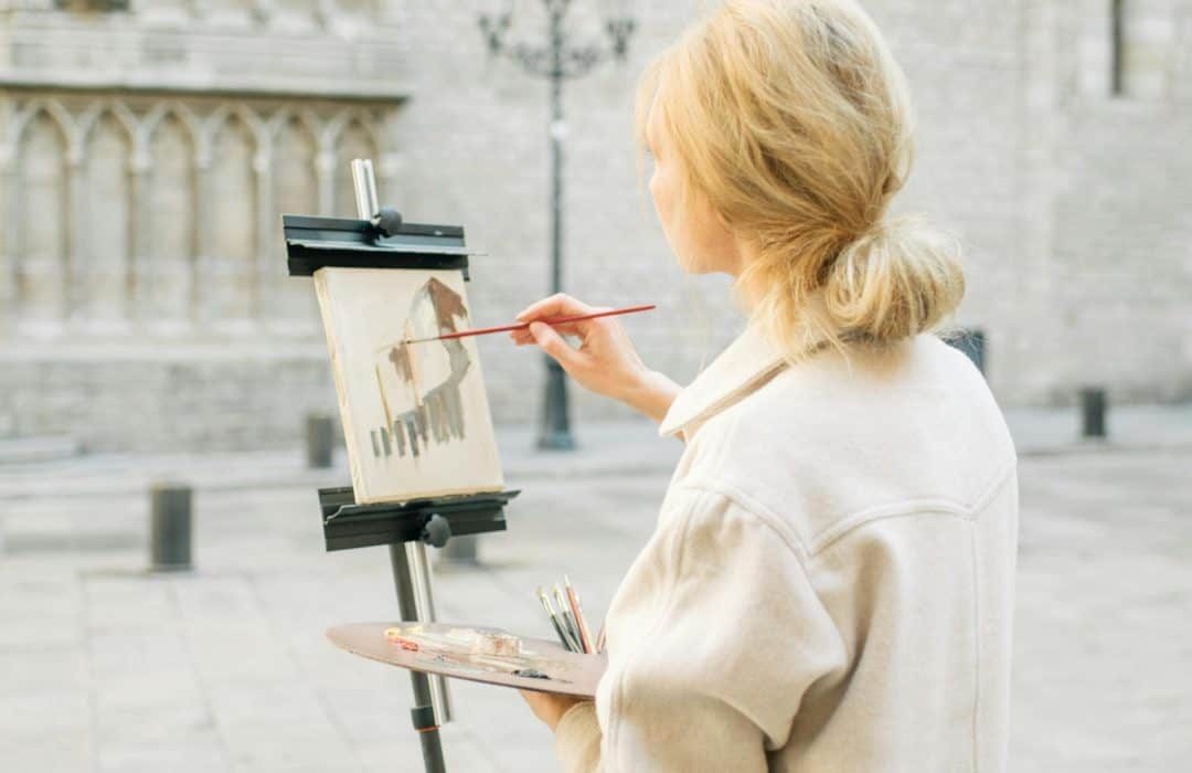 girl painting on canvass